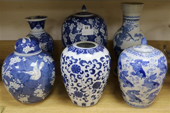 A 19th century Chinese blue and white prunus pattern vase and cover, 35cm., three other jars, two covers and